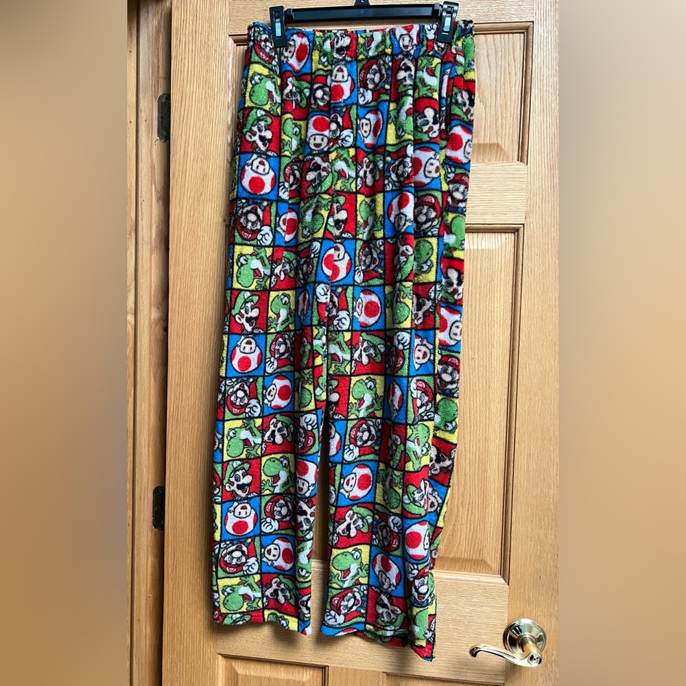 Mens Super Mario pajama pants with an all-over character grid print. Size Med.